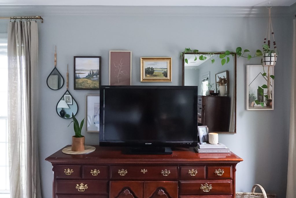 Dresser with Tv on top and gallery art wall behind tv