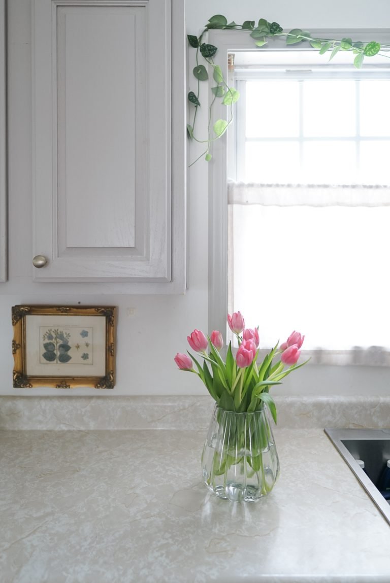 vase of tulips in kitchen